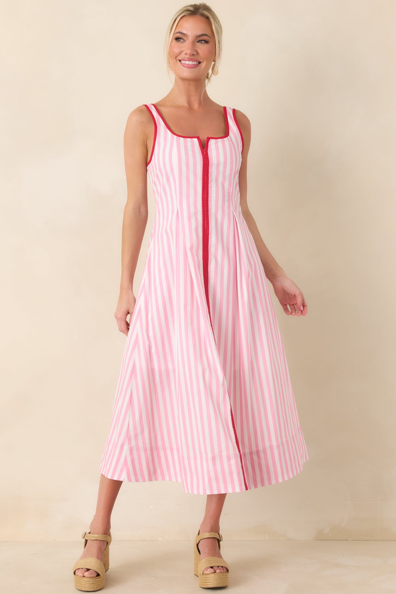 Vertical stripe pink and white dress with smooth silhouette and polished fit.