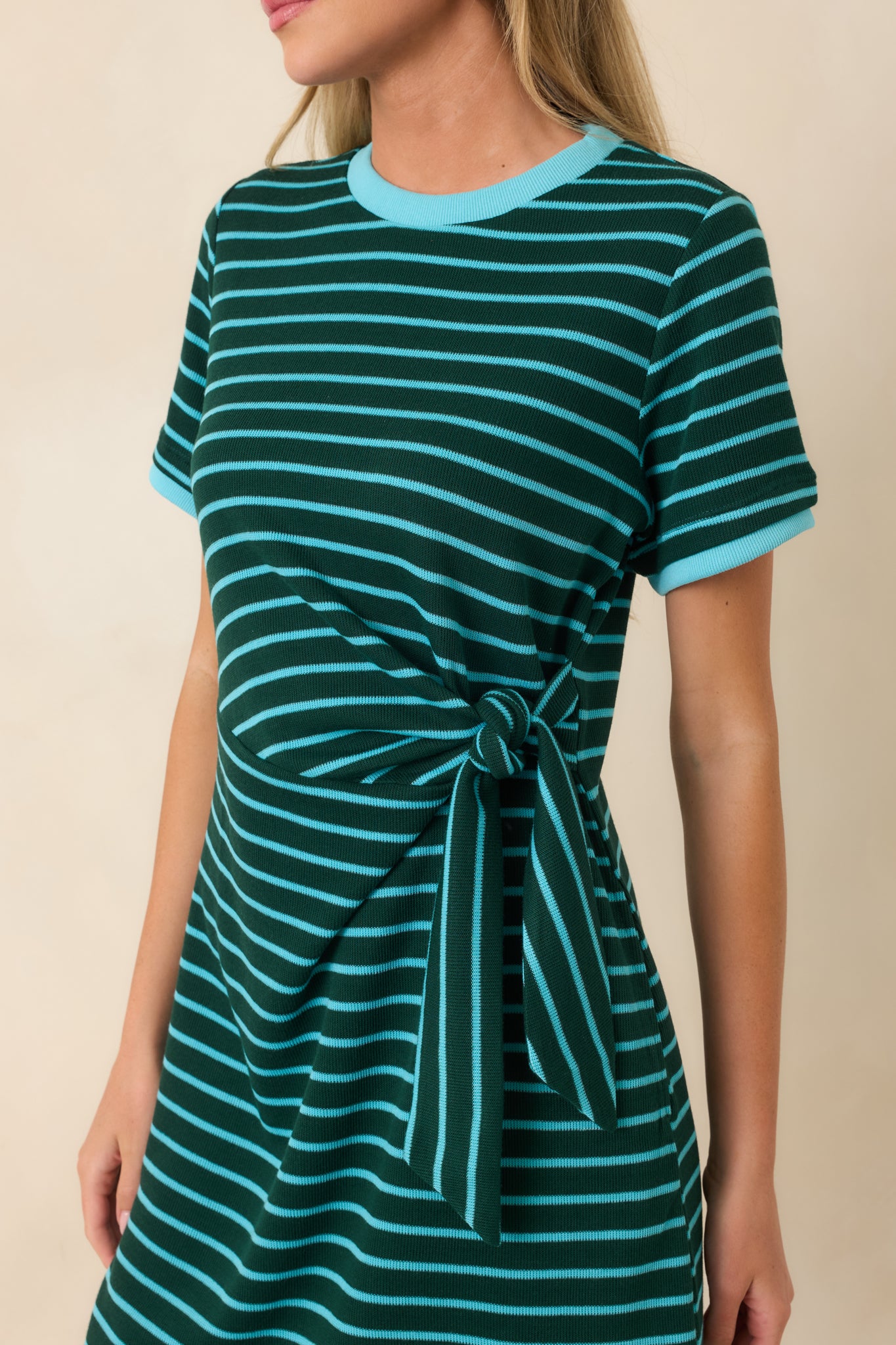 Close-up of the striped knit fabric displaying the black and cream pattern, contrast trim, and soft polyester-rayon blend texture.