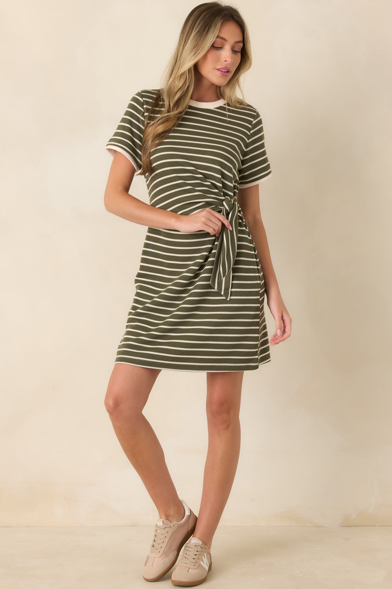 Casual striped mini dress designed with short sleeves, a crew neck, and a wrap-inspired tie accent for a polished yet effortless look.