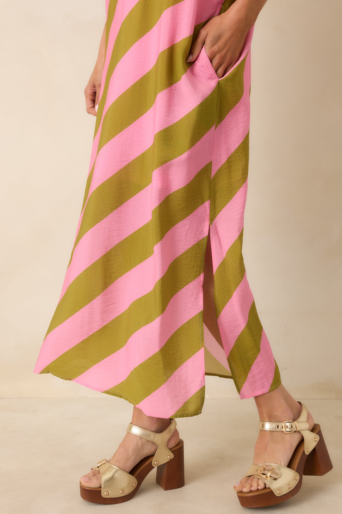 Floral striped maxi dress focusing on flowing bottom hem and side slit detail.