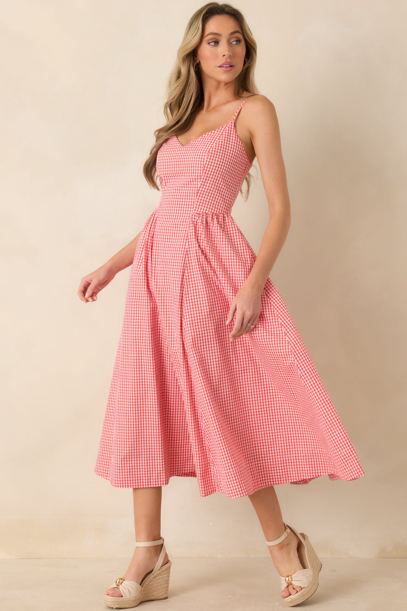 Striped midi dress with delicate shoulder straps and balanced relaxed fit.