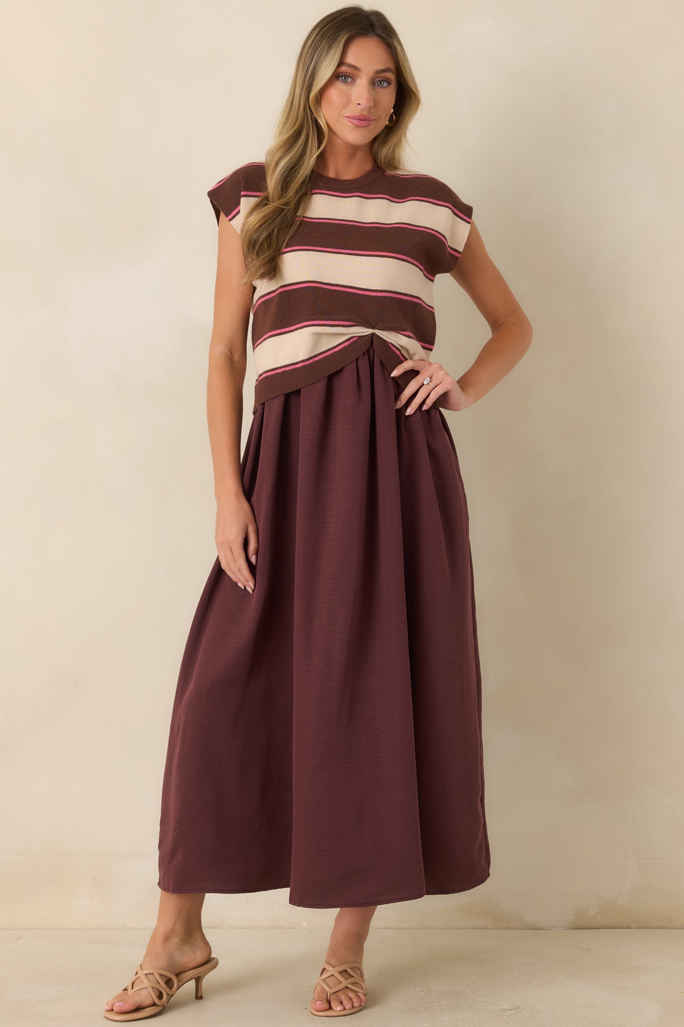 Striped sweater-style maxi dress with cap sleeves, a classic crew neckline, and a flowing A-line silhouette.