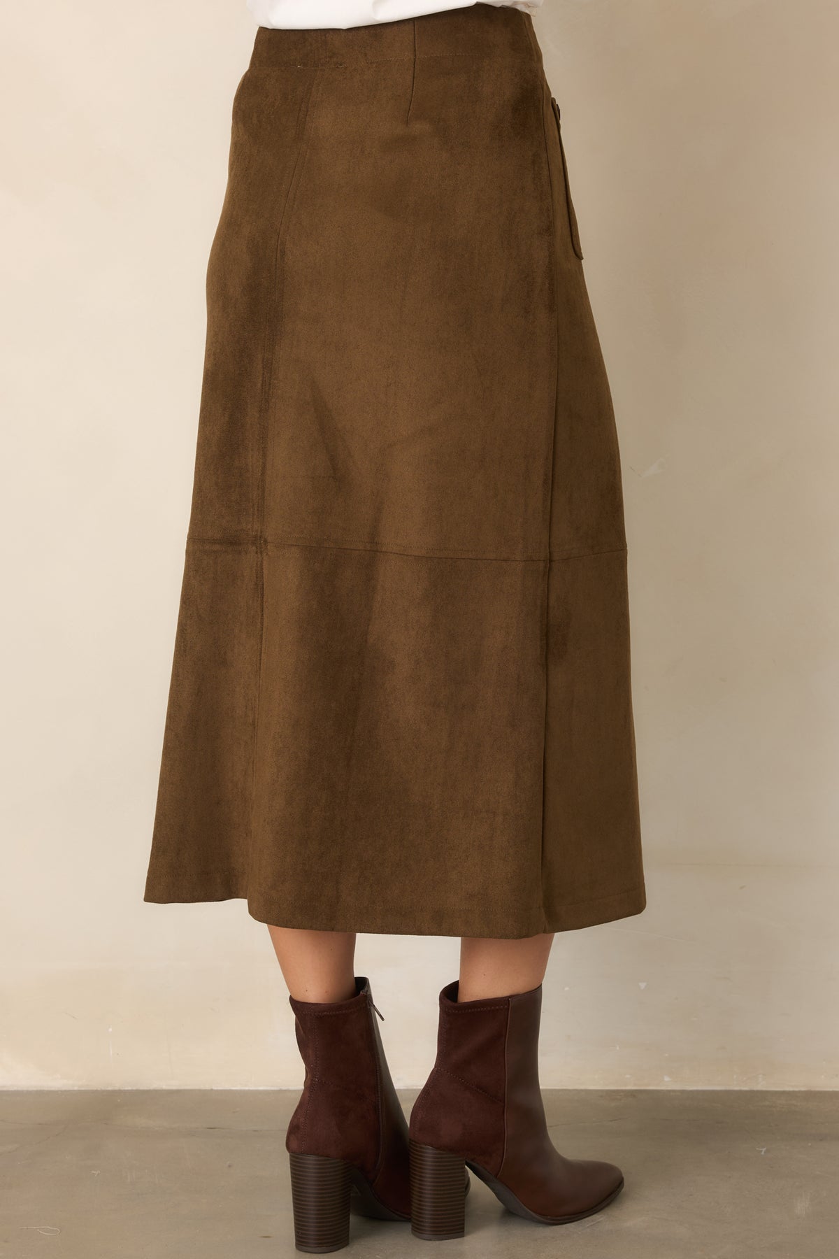 Rear view of the structured midi skirt showcasing its clean, tailored silhouette.
