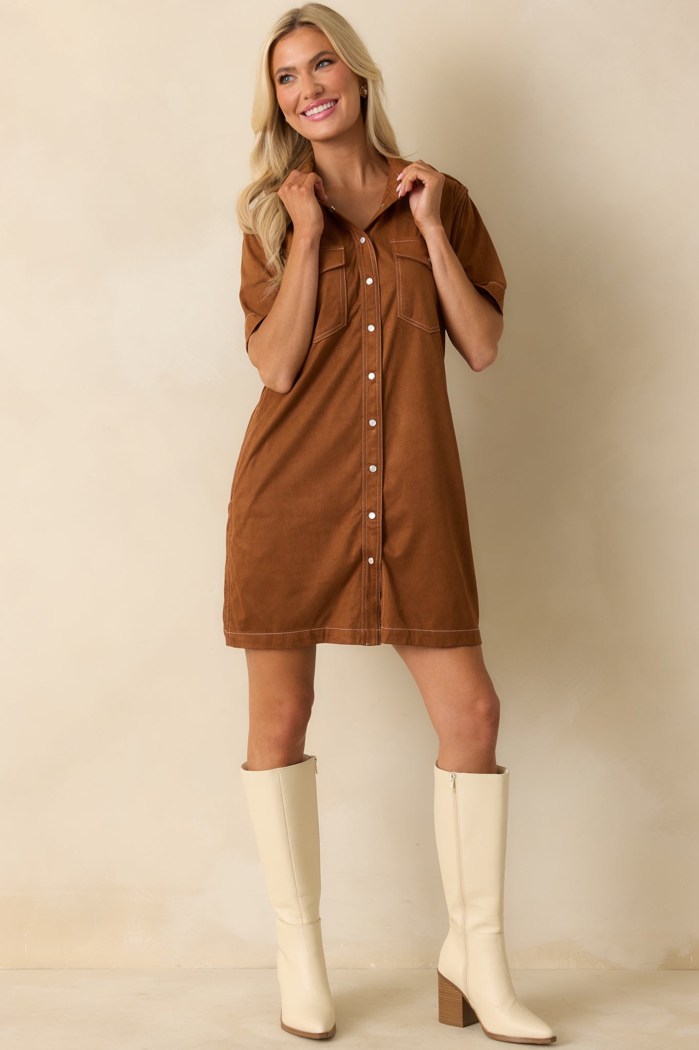 Structured mini dress in cinnamon brown featuring short sleeves and smooth faux suede fabric.