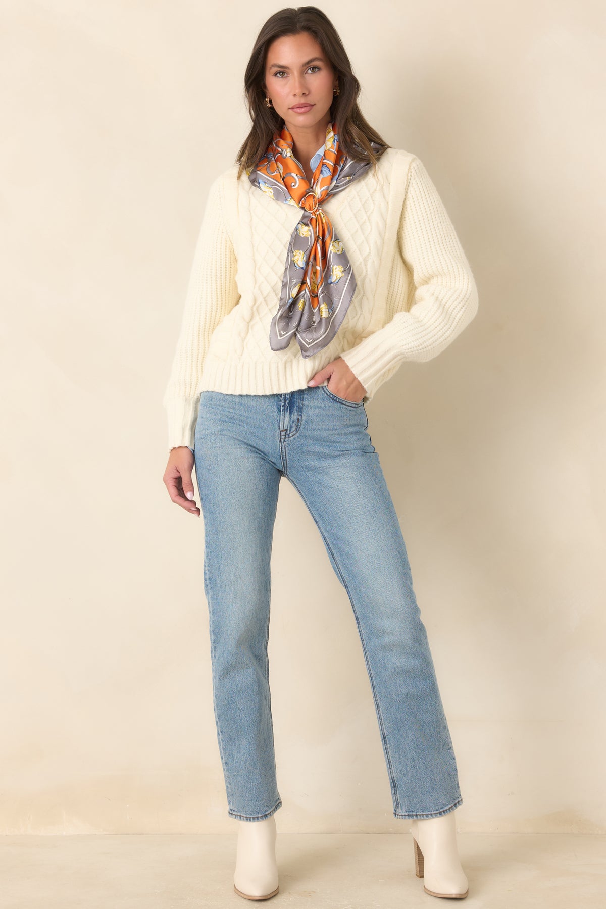 Cotton-rich denim jeans featuring a high-rise waist, subtle fading, and a clean straight-leg silhouette.