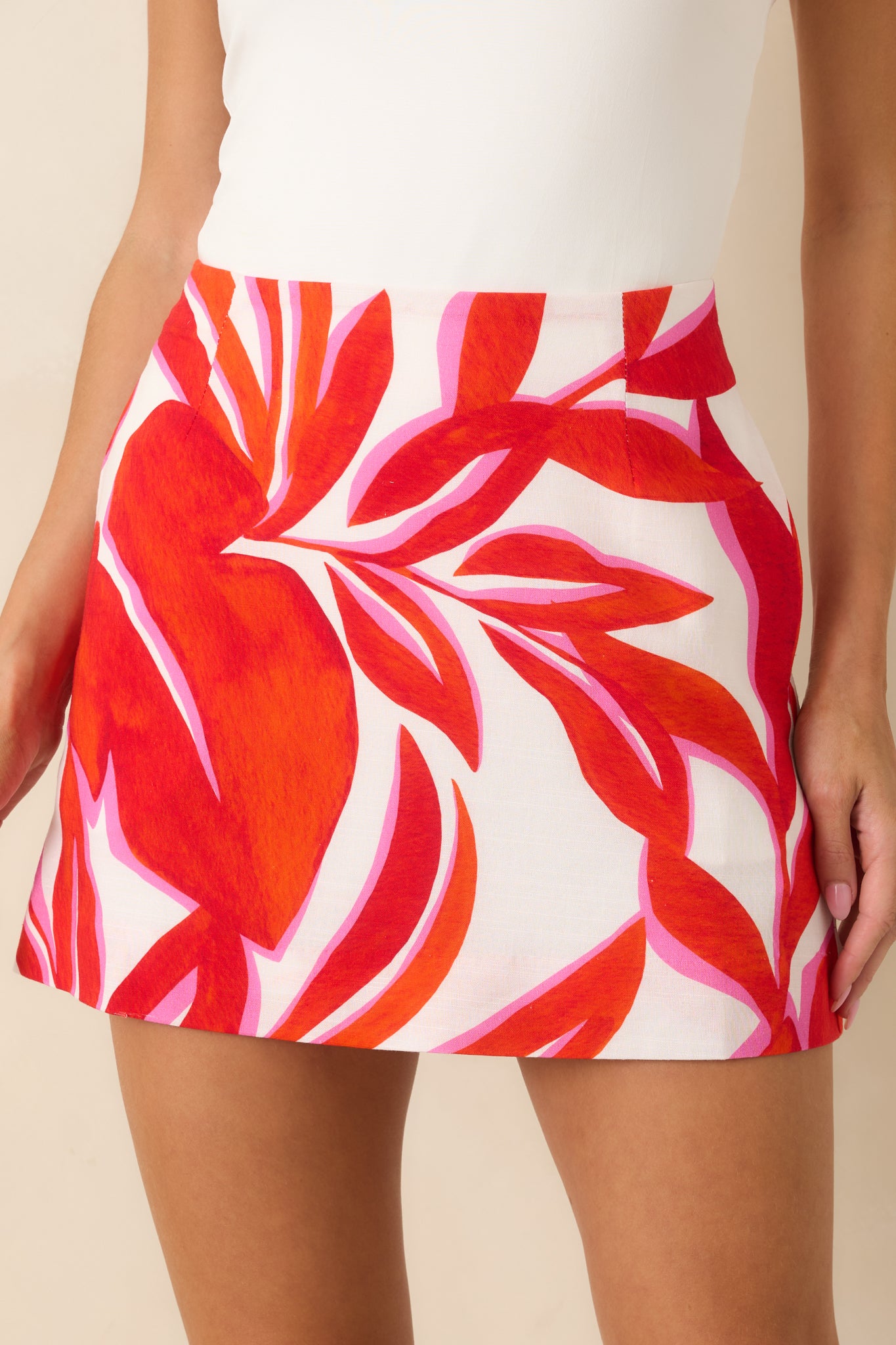 Close-up of the structured woven fabric and bold multicolor pattern on the skirt.
