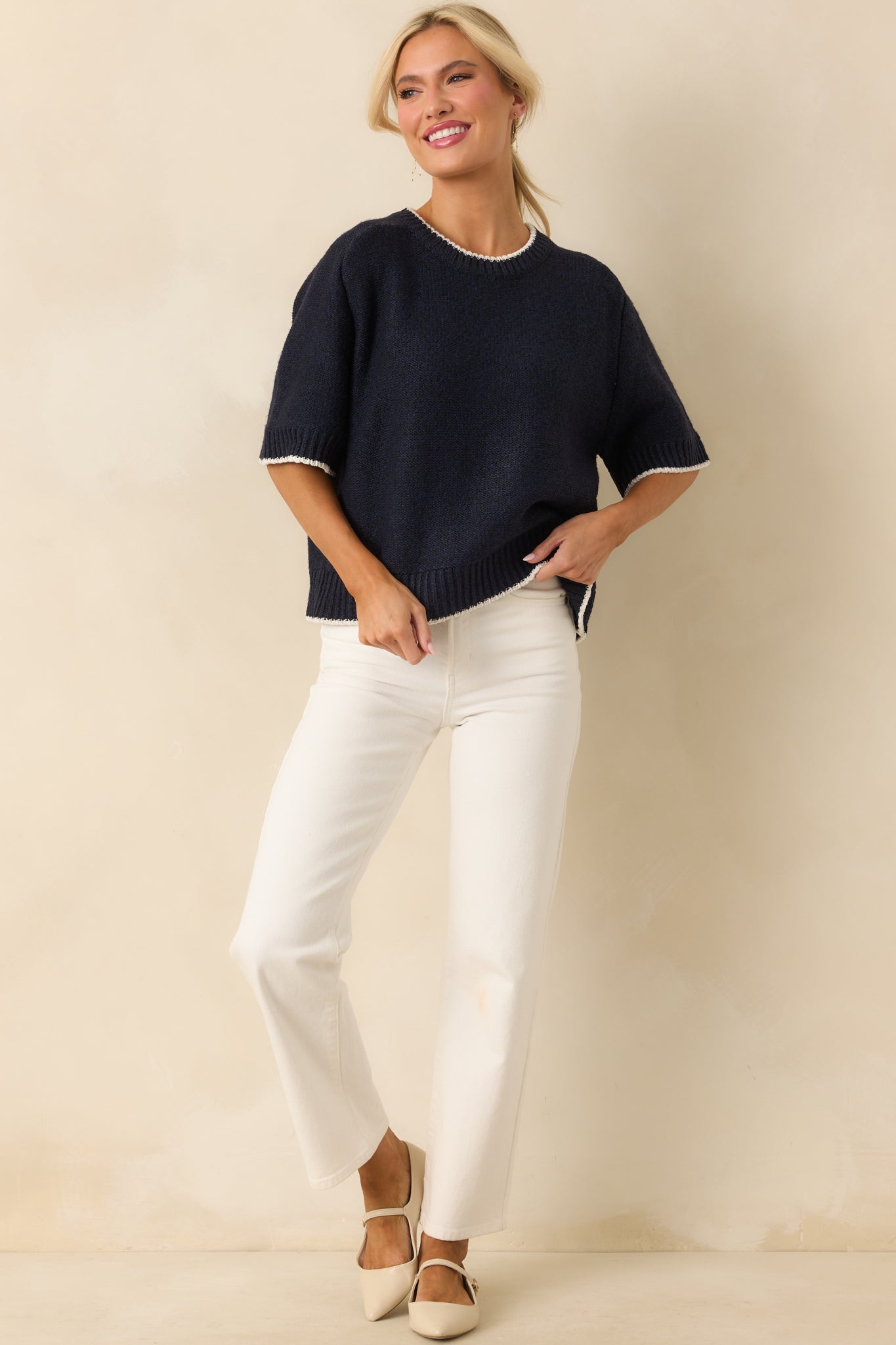Sweater shown front facing, emphasizing the ivory contrast trim and relaxed silhouette.