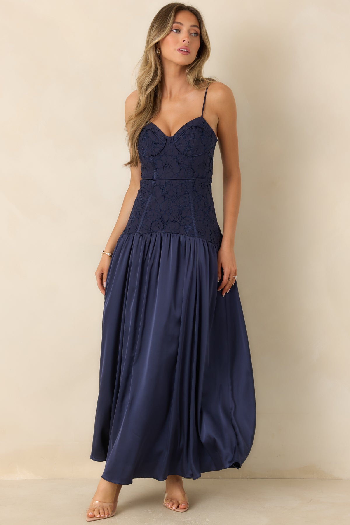 Sweetheart maxi dress with delicate adjustable straps, a structured lace bodice, and a flowing satin skirt.