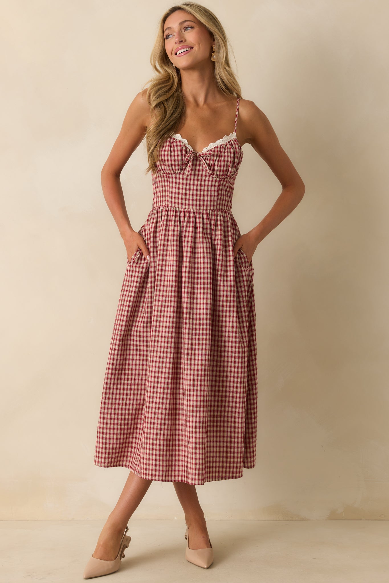 Sweetheart neckline red gingham dress with adjustable straps and a flattering fitted bodice.