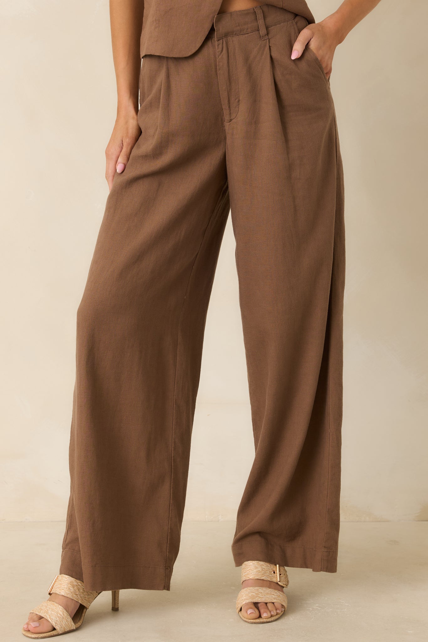 Tailored chestnut pants showcasing the clean silhouette, structured fit, and comfortable waistband design.