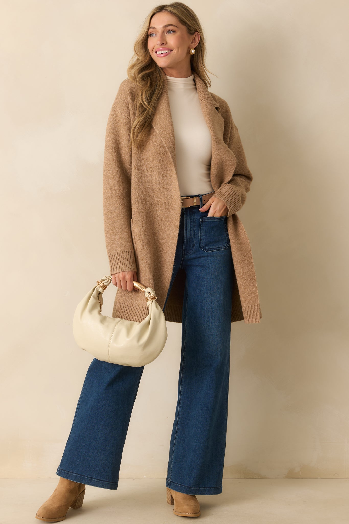 Tailored dark wash jeans with functional back pockets and clean straight-leg silhouette.