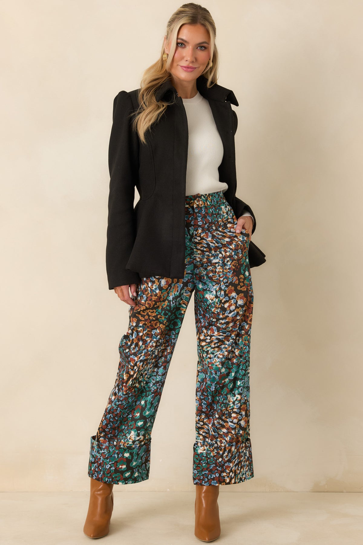 Tailored felt jacket showcasing the fitted waist and sculptural peplum silhouette.