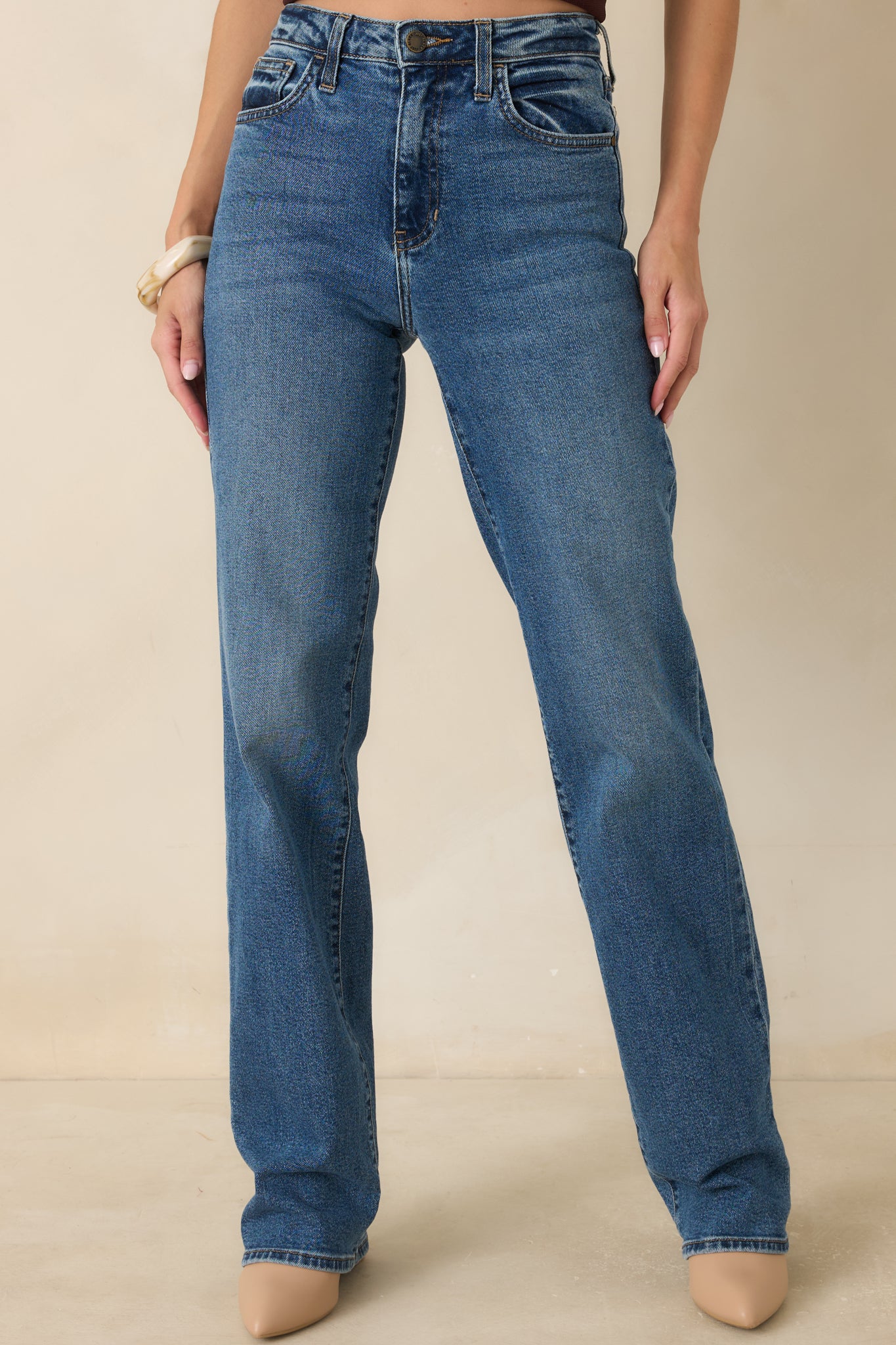 Detailed view of the waistband and front construction showcasing the clean tailoring and refined finish of the pants.