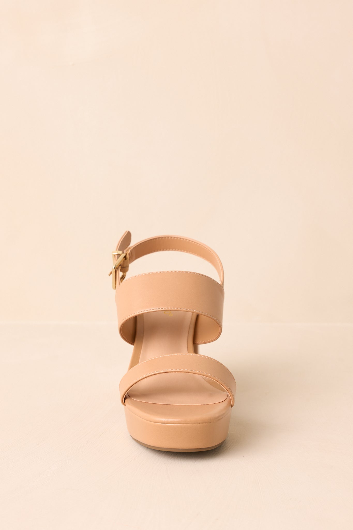 Tan block heel sandals displayed at a front angle, showing the two wide straps across the foot.