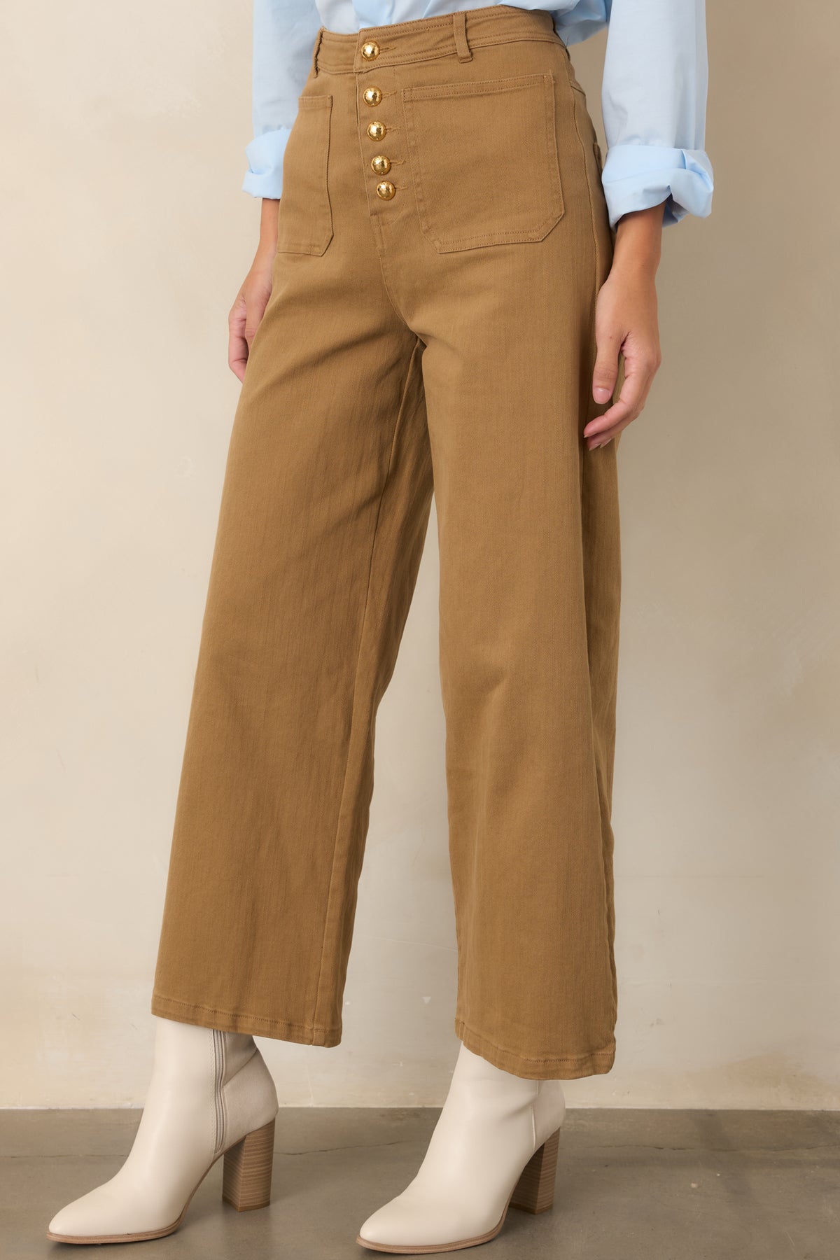 Warm tan wide-leg pants featuring the relaxed cropped silhouette and neatly finished front pocket detailing.