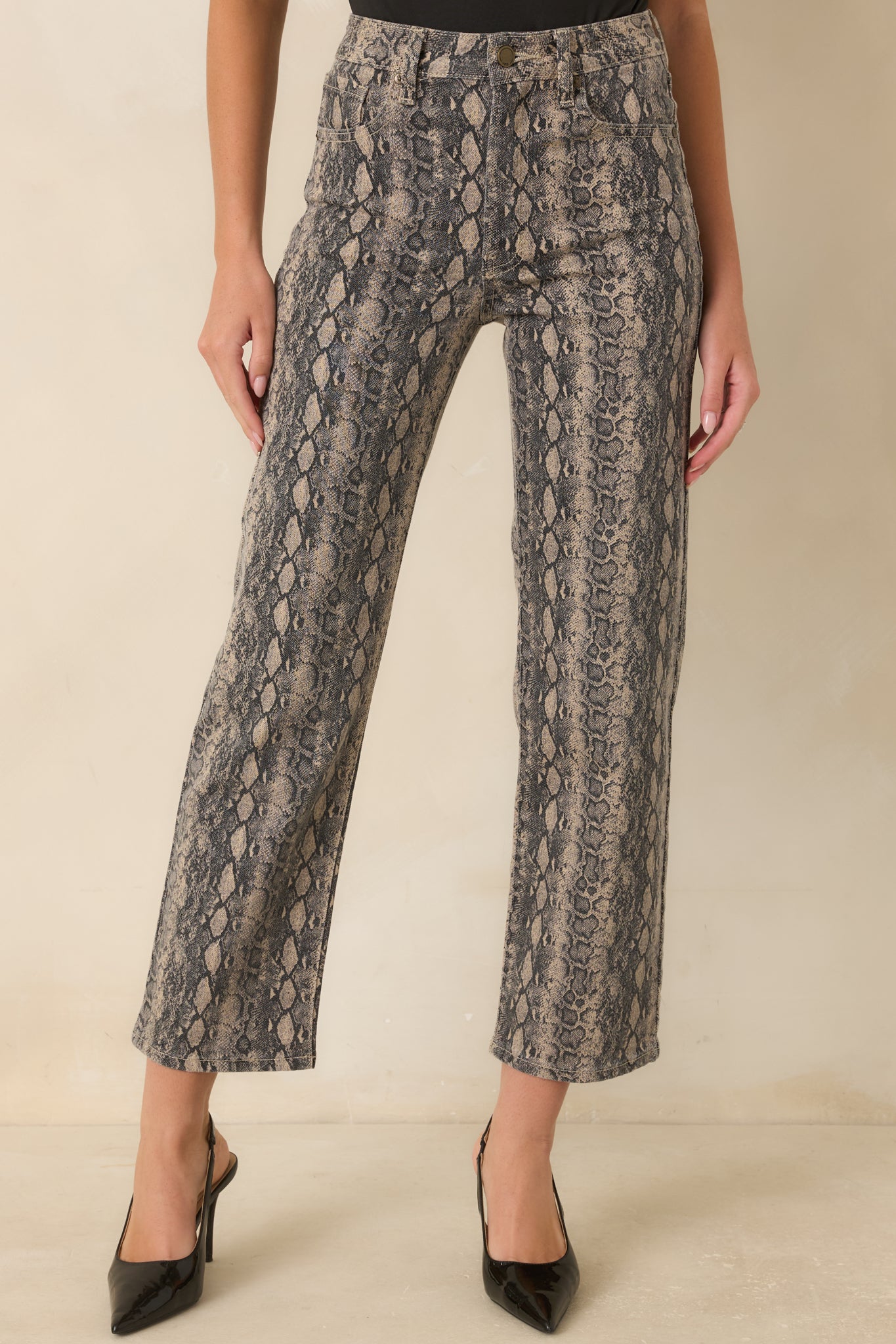 Tan and gray denim featuring the textured snakeskin print, button closure, and stretch fabric finish.