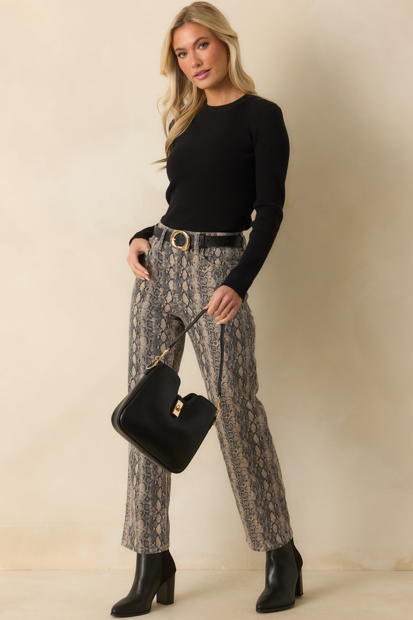 Tan and gray snakeskin print jeans with a high-rise waist and straight-leg silhouette.