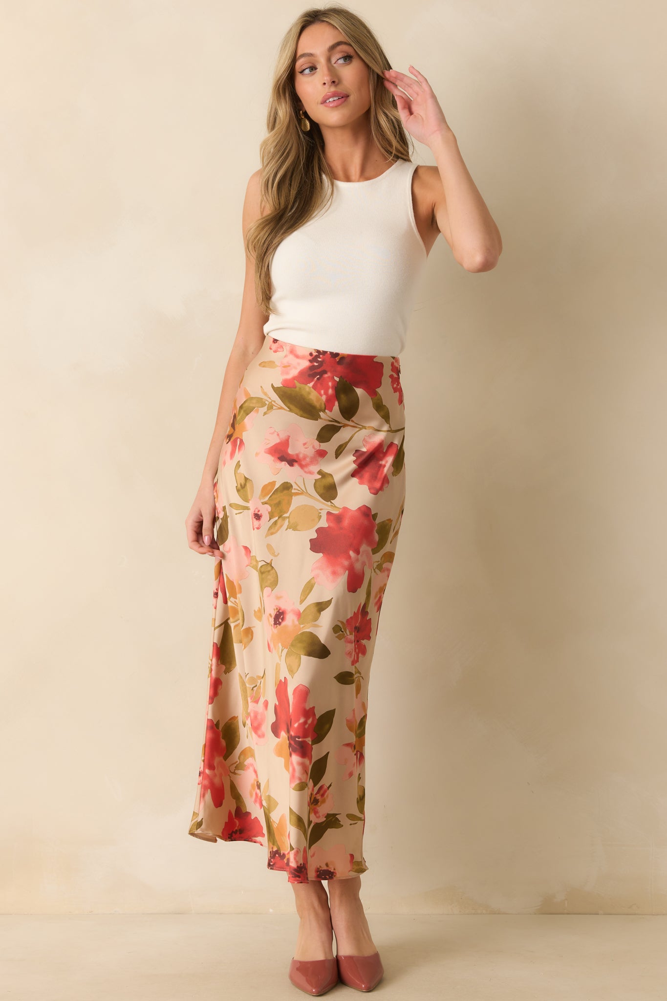 Tan maxi skirt with high-rise elastic waistband and a watercolor-inspired pink multicolor floral print.