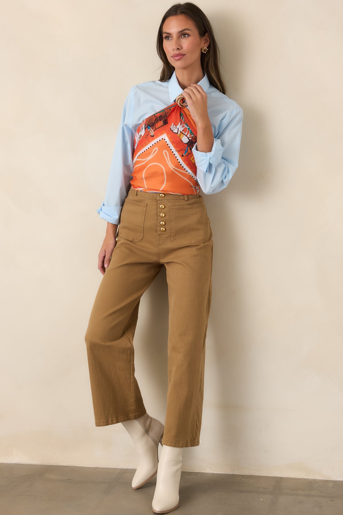 Warm tan stretch cotton pants with a high rise, gold-tone button front, and cropped wide-leg silhouette.