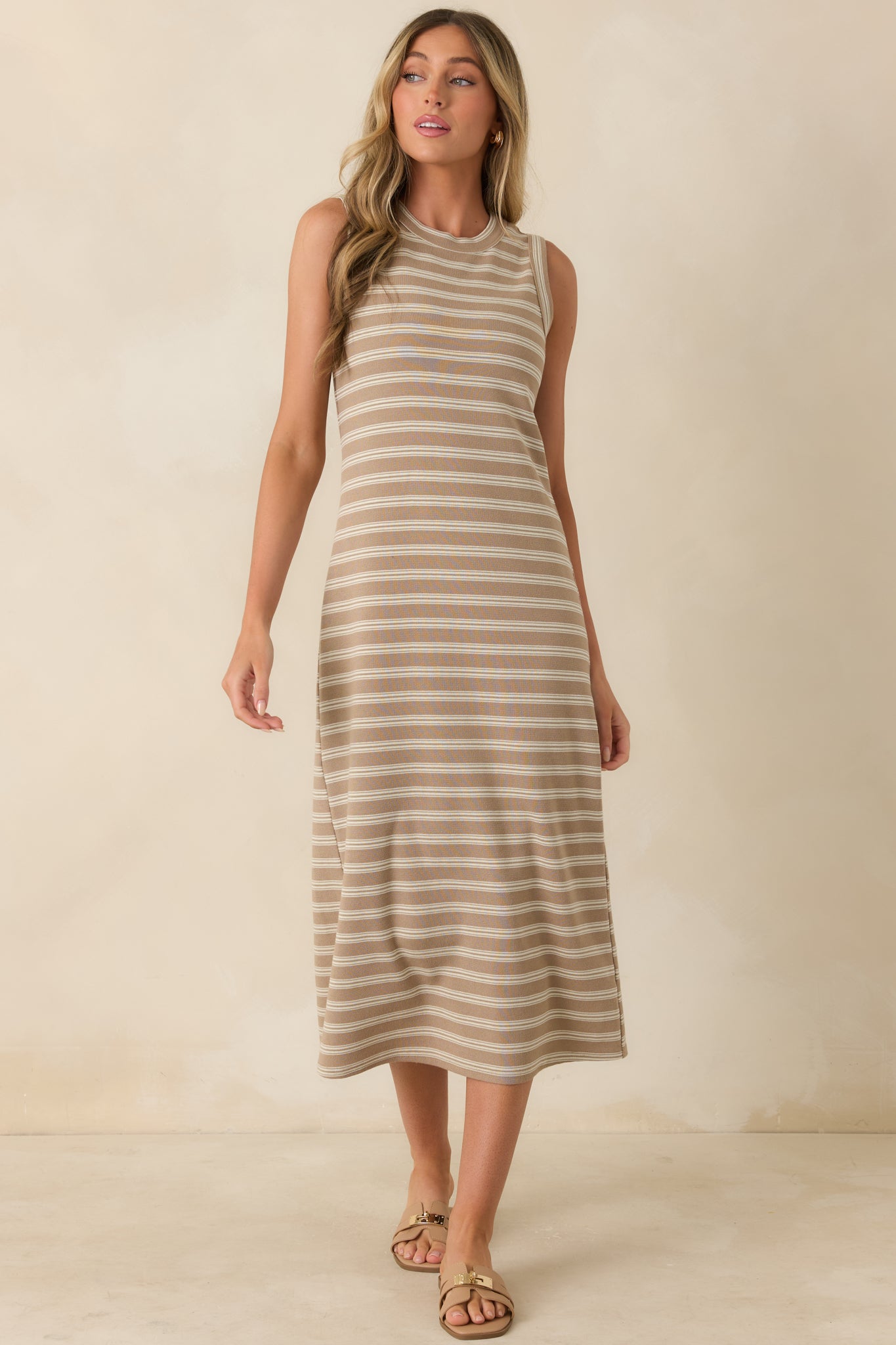 Taupe stripe dress featuring a lightweight knit construction and versatile sleeveless design.