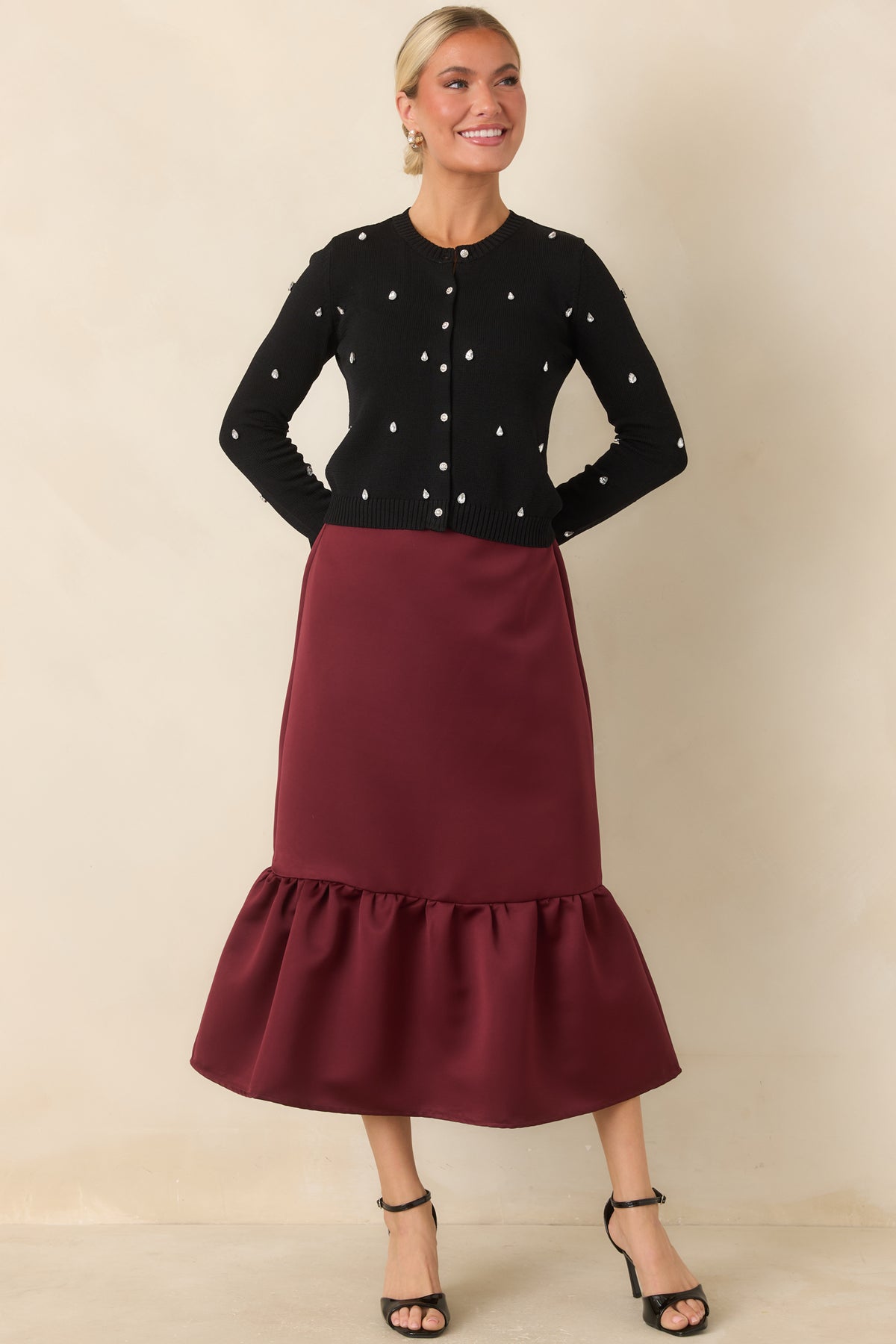 Cardigan with teardrop rhinestones across the front and long sleeves, finished with shimmering round buttons.