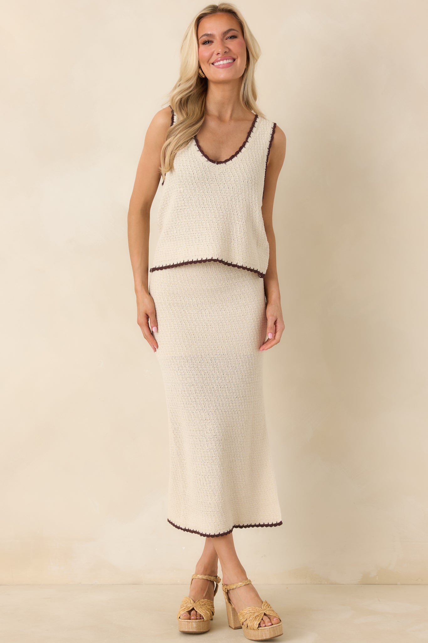 Textured beige knit maxi skirt featuring comfortable stretch, pull-on waistband, and subtle whipstitch detailing along the bottom edge.