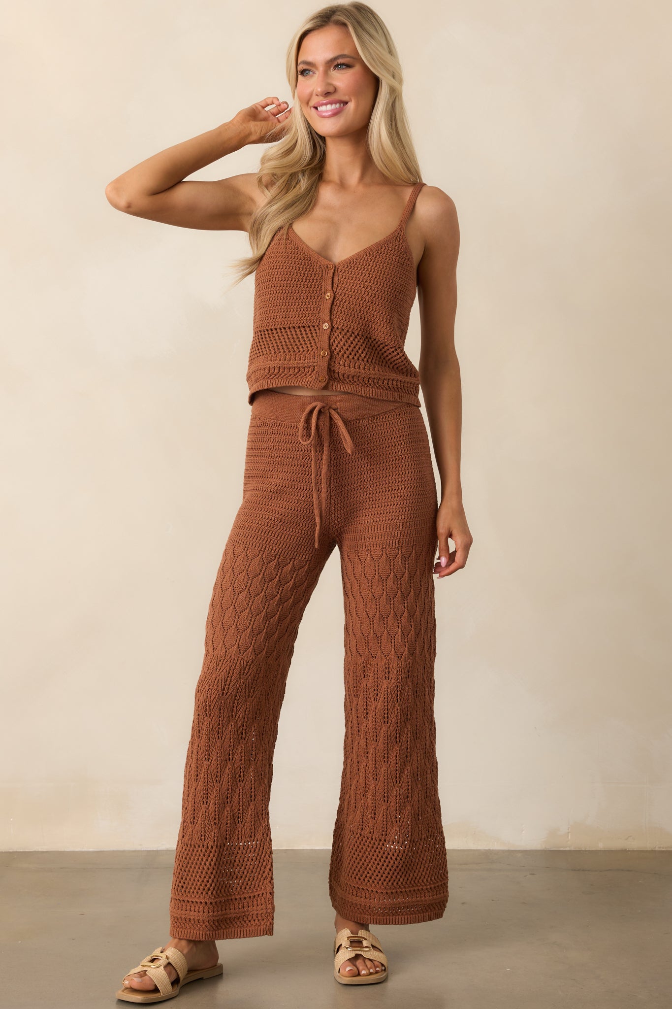 Textured brown tank with crochet detailing and a vertical button-down front, worn with ease and casual structure.