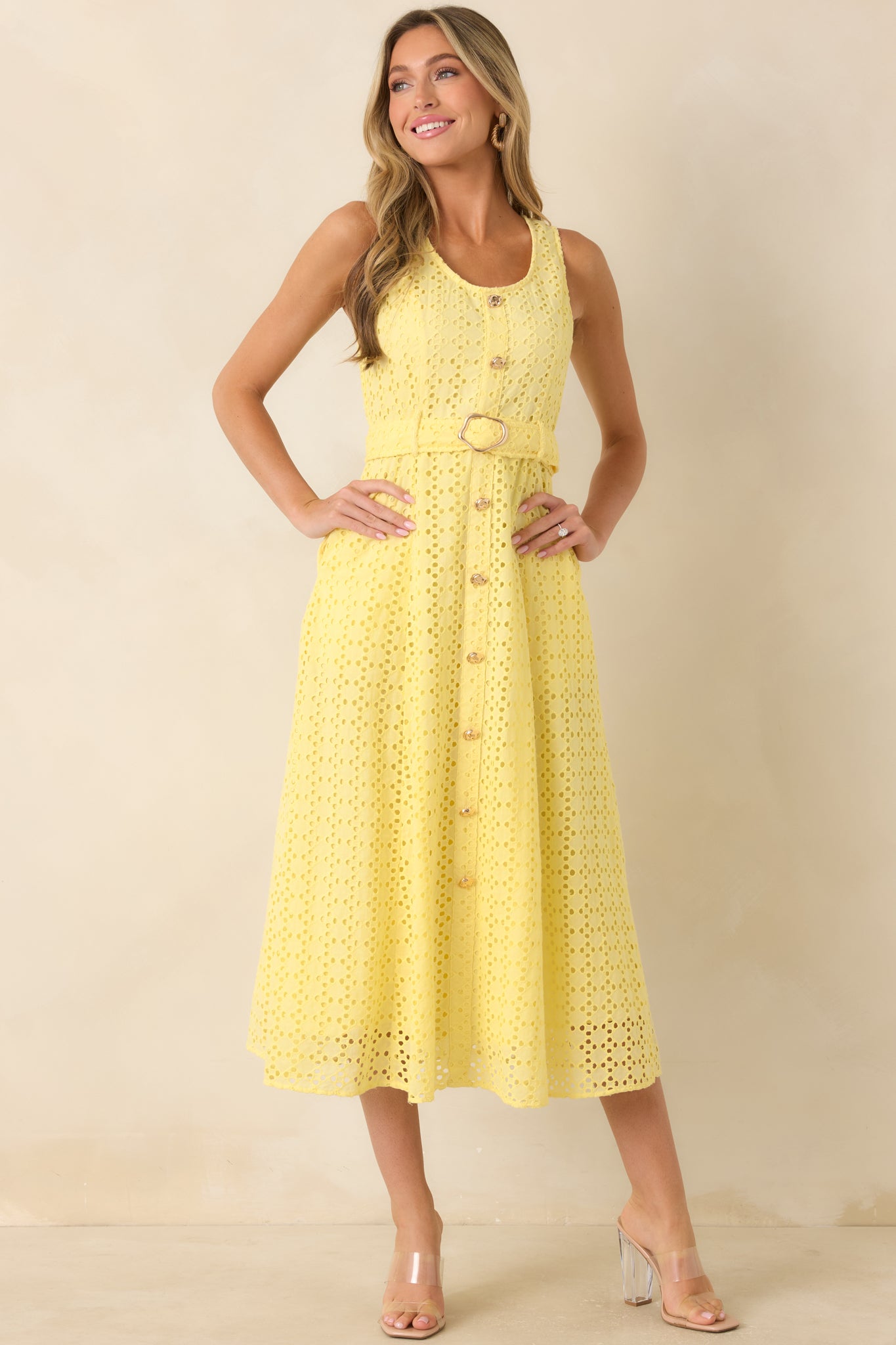 Breathable cotton midi dress designed with textured eyelet fabric and a removable belt for waist definition.