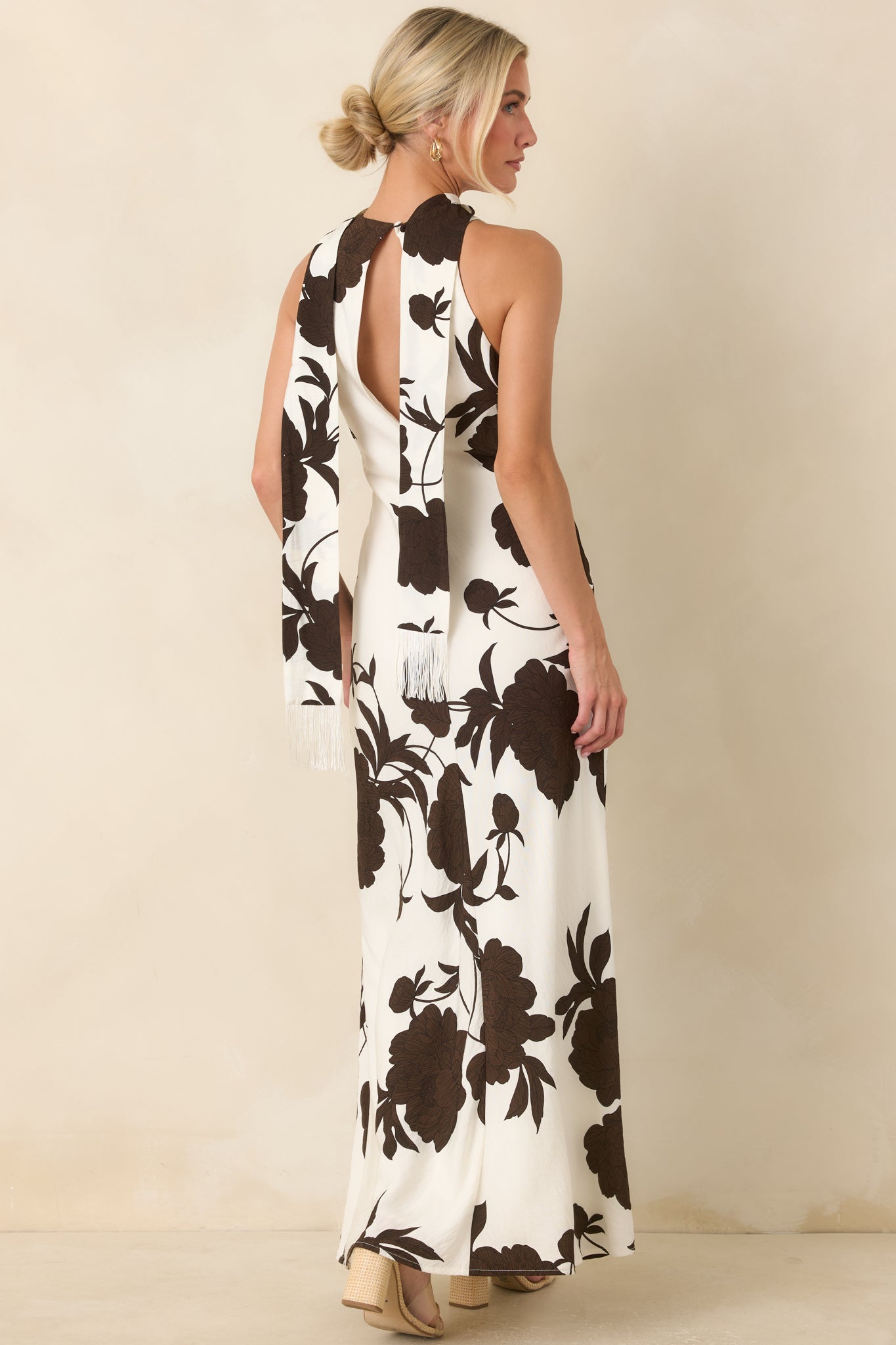 Back of the textured viscose blend maxi dress featuring an open keyhole design and single button closure.