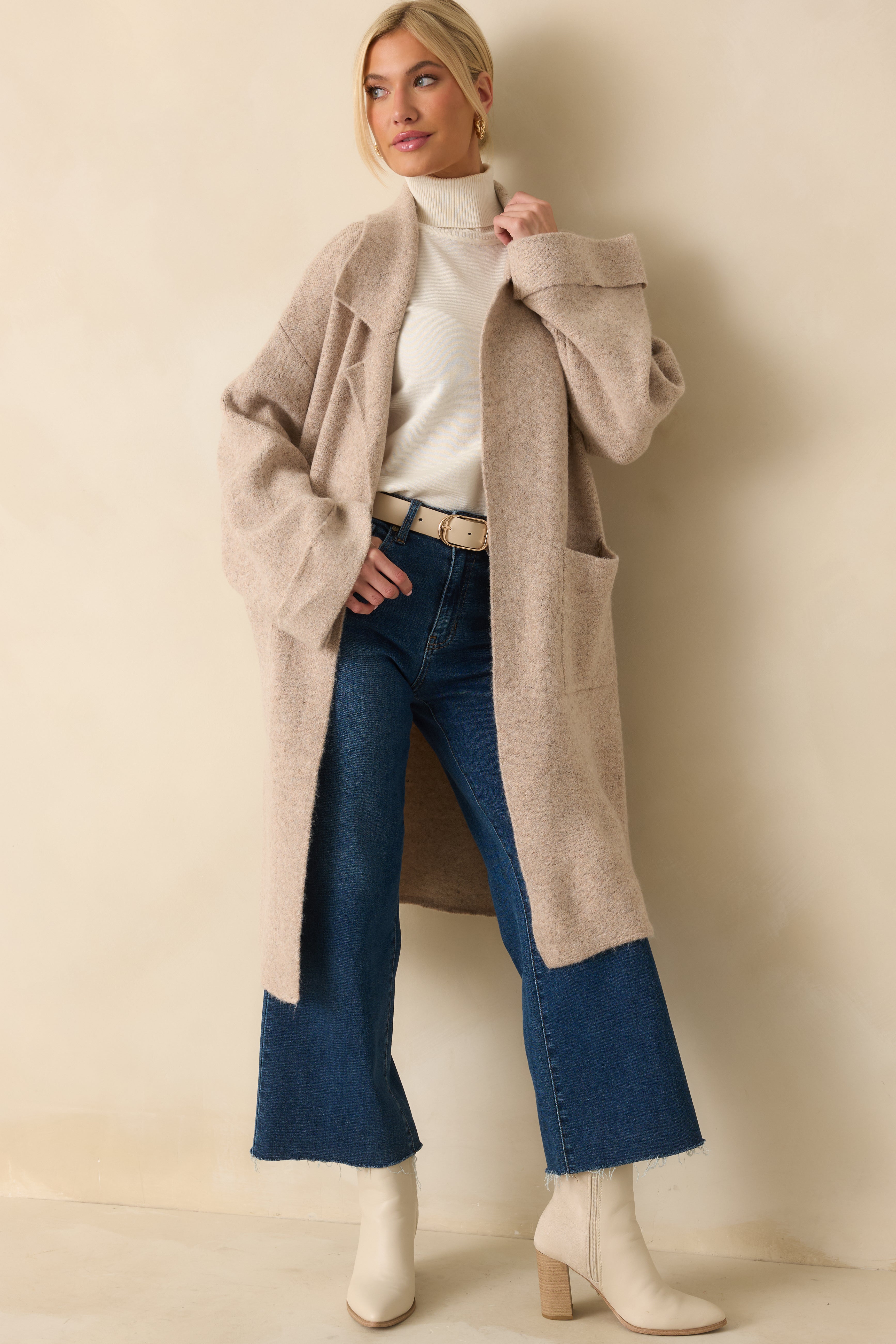 Soft textured knit cardigan highlighting its open-front style and cozy, elongated fit