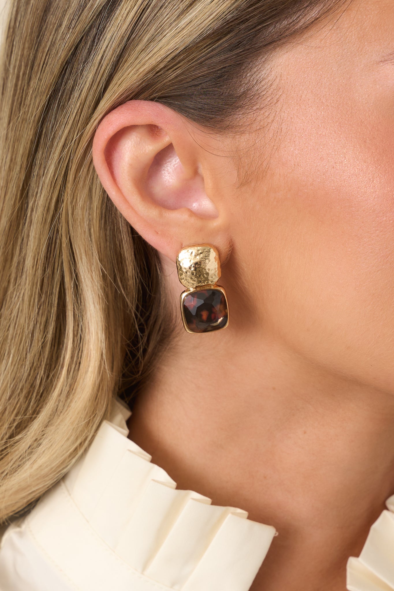 Rounded square earrings featuring a modern textured design, warm neutral tones, and a lightweight statement silhouette.