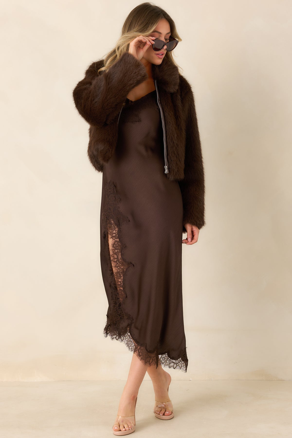 Textured satin dress with a body-skimming fit and an asymmetrical lace-trimmed skirt.