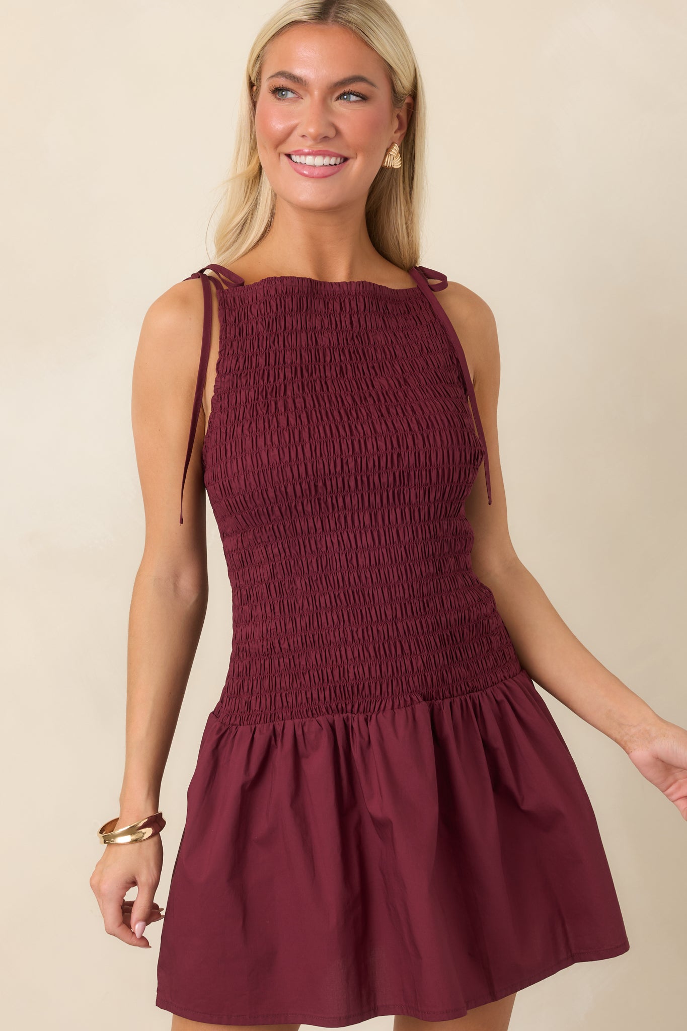 Detailed view of the dress highlighting the textured shirring and comfortable fitted construction through the bodice.