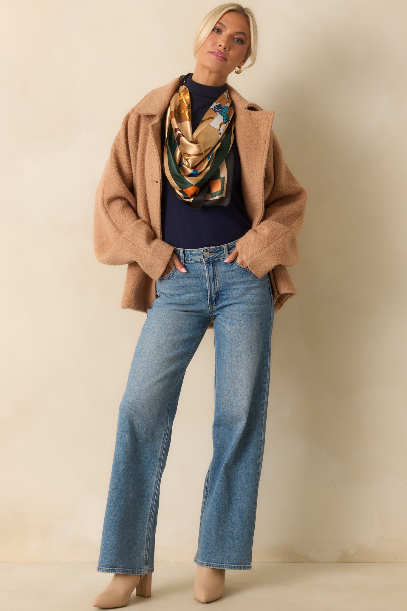 Textured wool-blend coat featuring welt side pockets and a clean straight hemline.