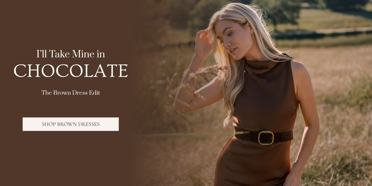 Split Banner that features a photo of a woman wearing a sleeveless brown, satin dress in a field that fades into a solid brown background featuring text that says, "I'll Take Mine in Chocolate. The Brown Dress Edit." It also features a button to shop the brown dress collection.