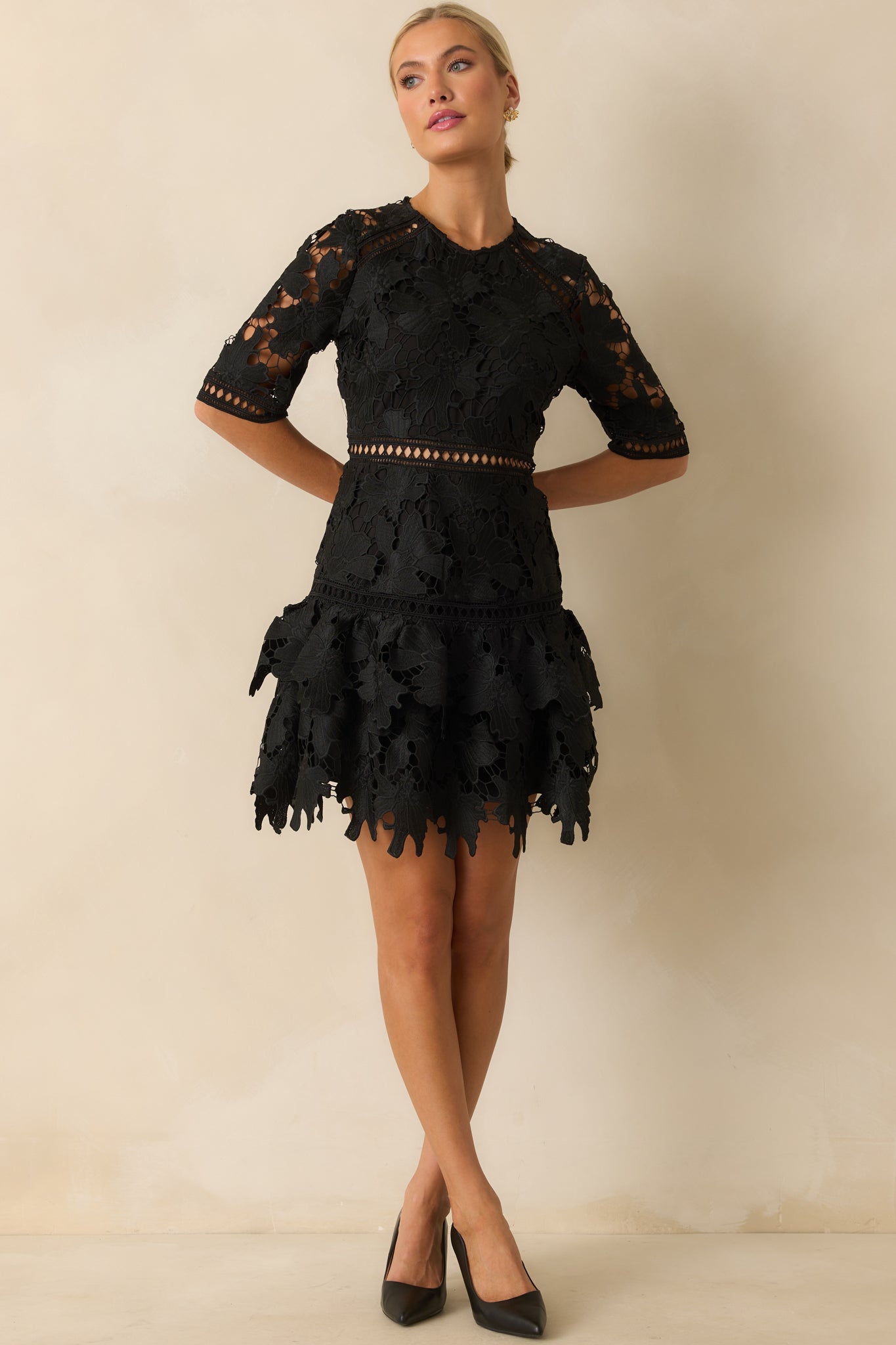 Tiered ruffle hem with scalloped edges adds texture to the lace mini dress.