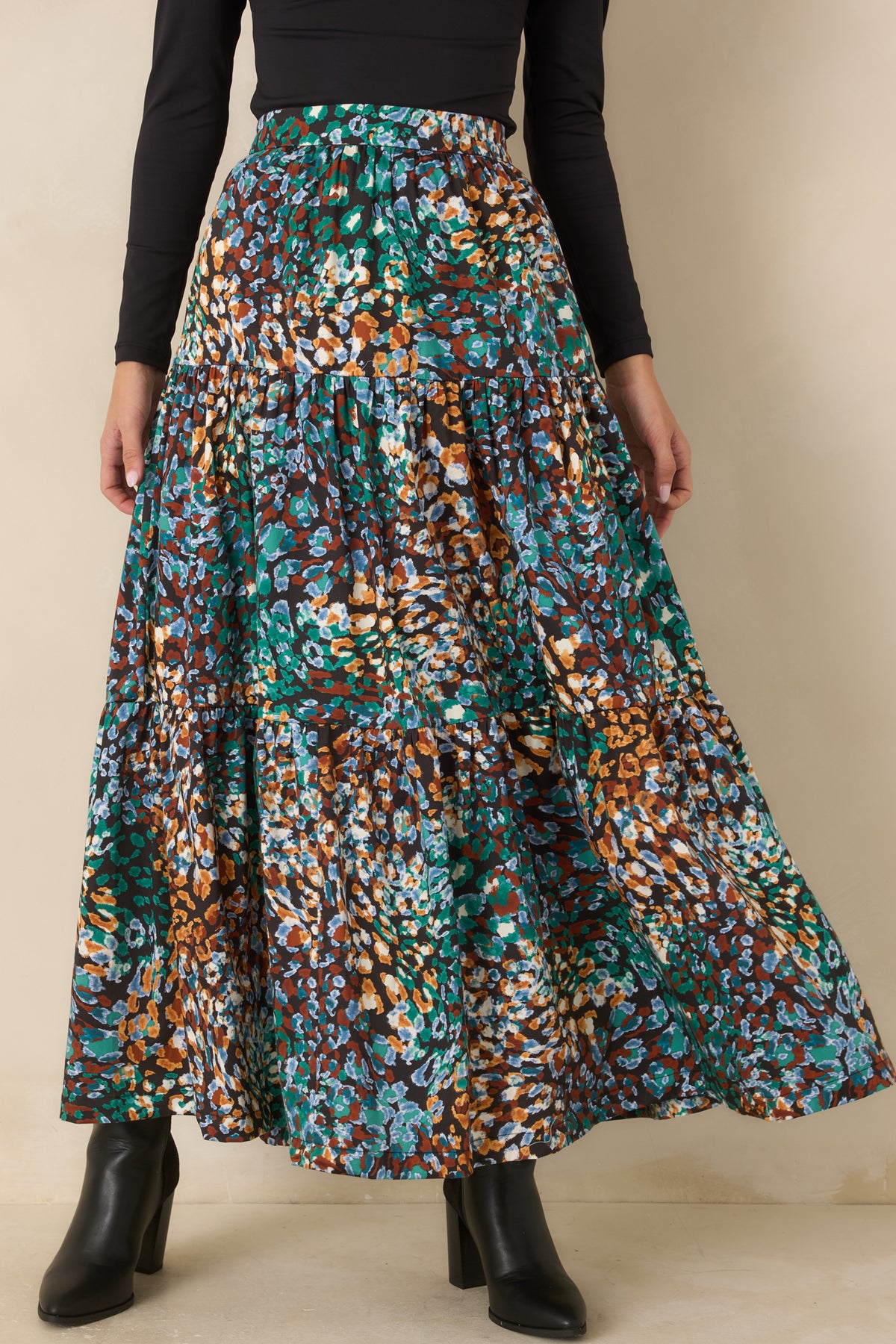 Tiered skirt displaying the gathered layers and flowing volume of the silhouette.