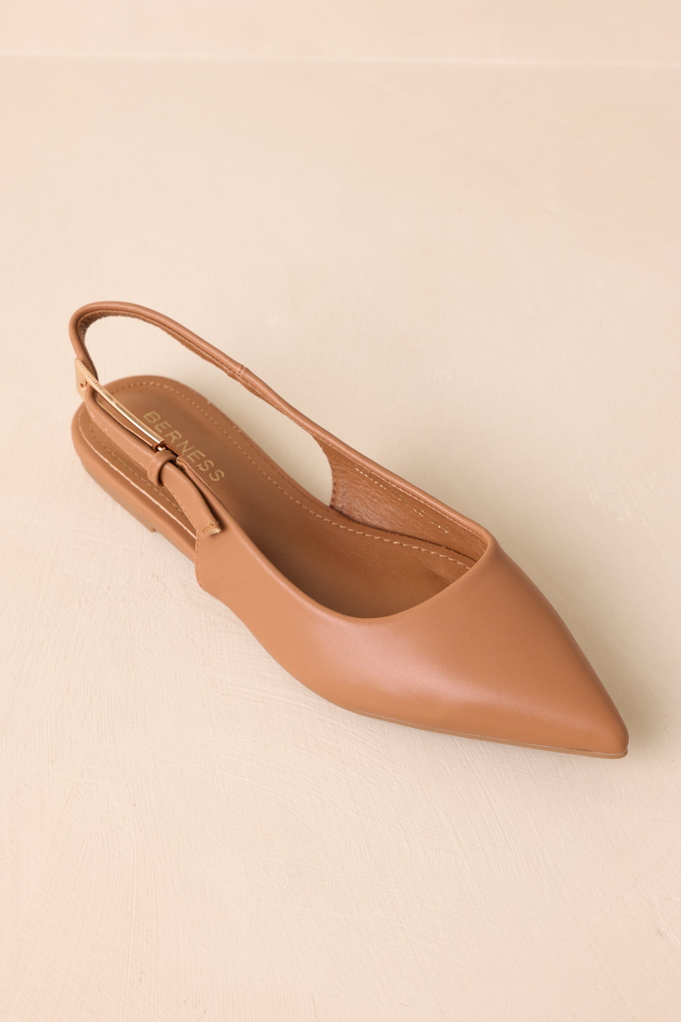 Top-down angle showing the cushioned insole and overall silhouette of the flats.