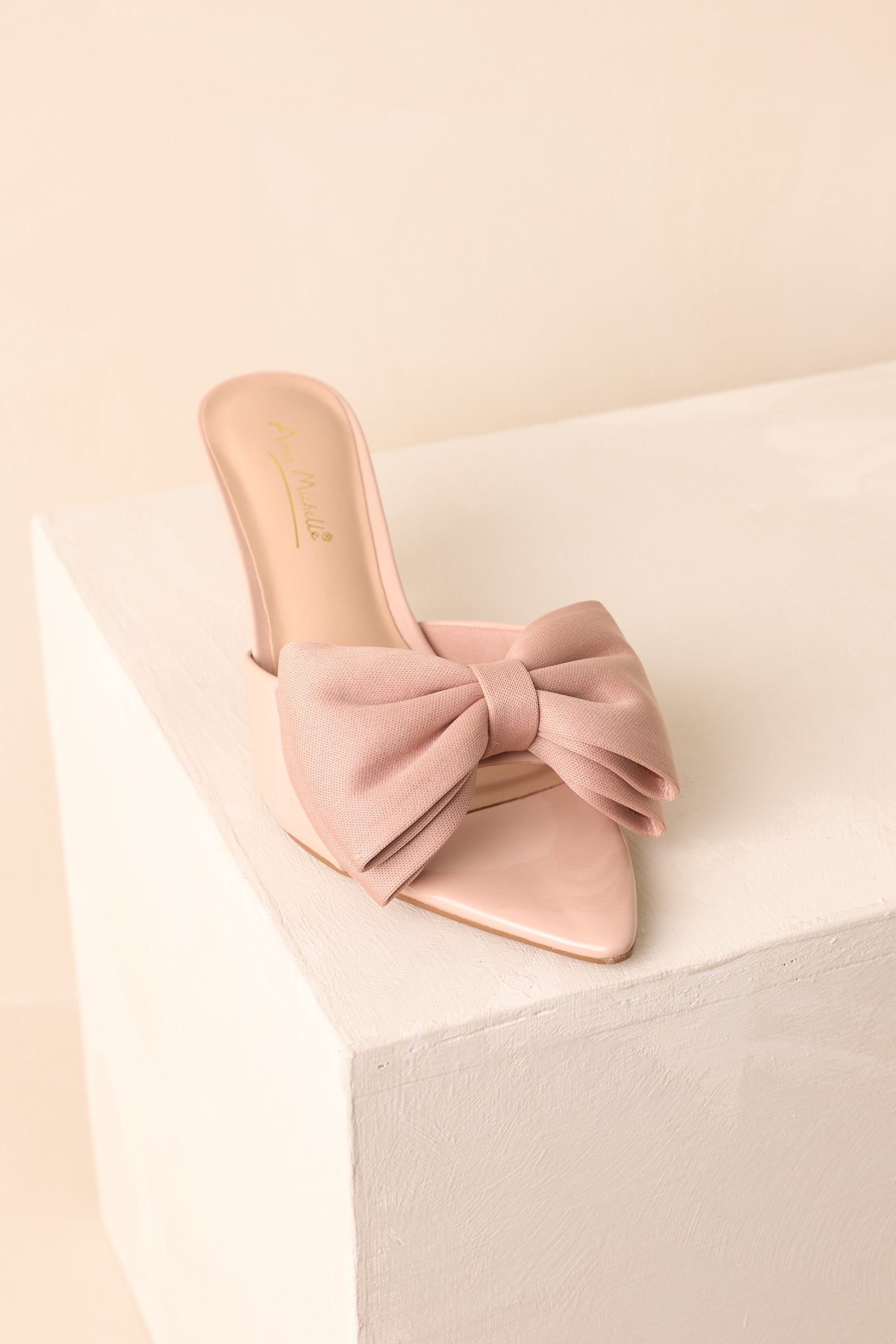 Top-down view showcasing the wide strap and oversized bow detail