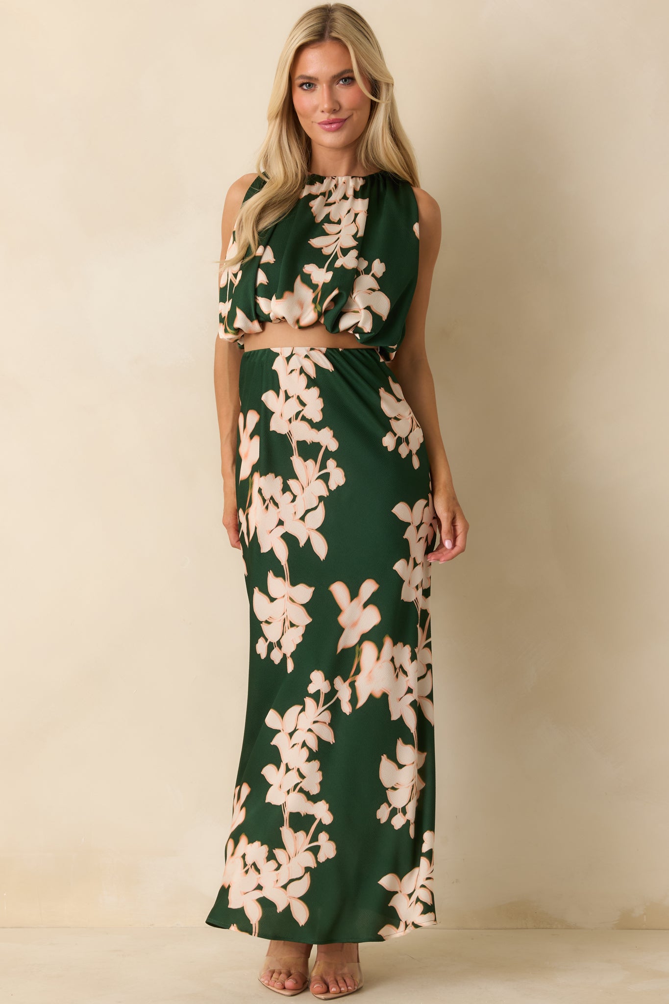 The top highlights the ruched construction and subtle sheen of the satin fabric in a cropped silhouette.