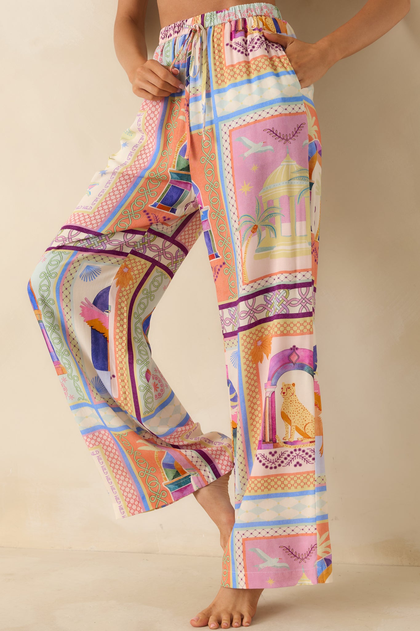 Close front view of the elastic waistband and relaxed upper fit of the tropical pants.