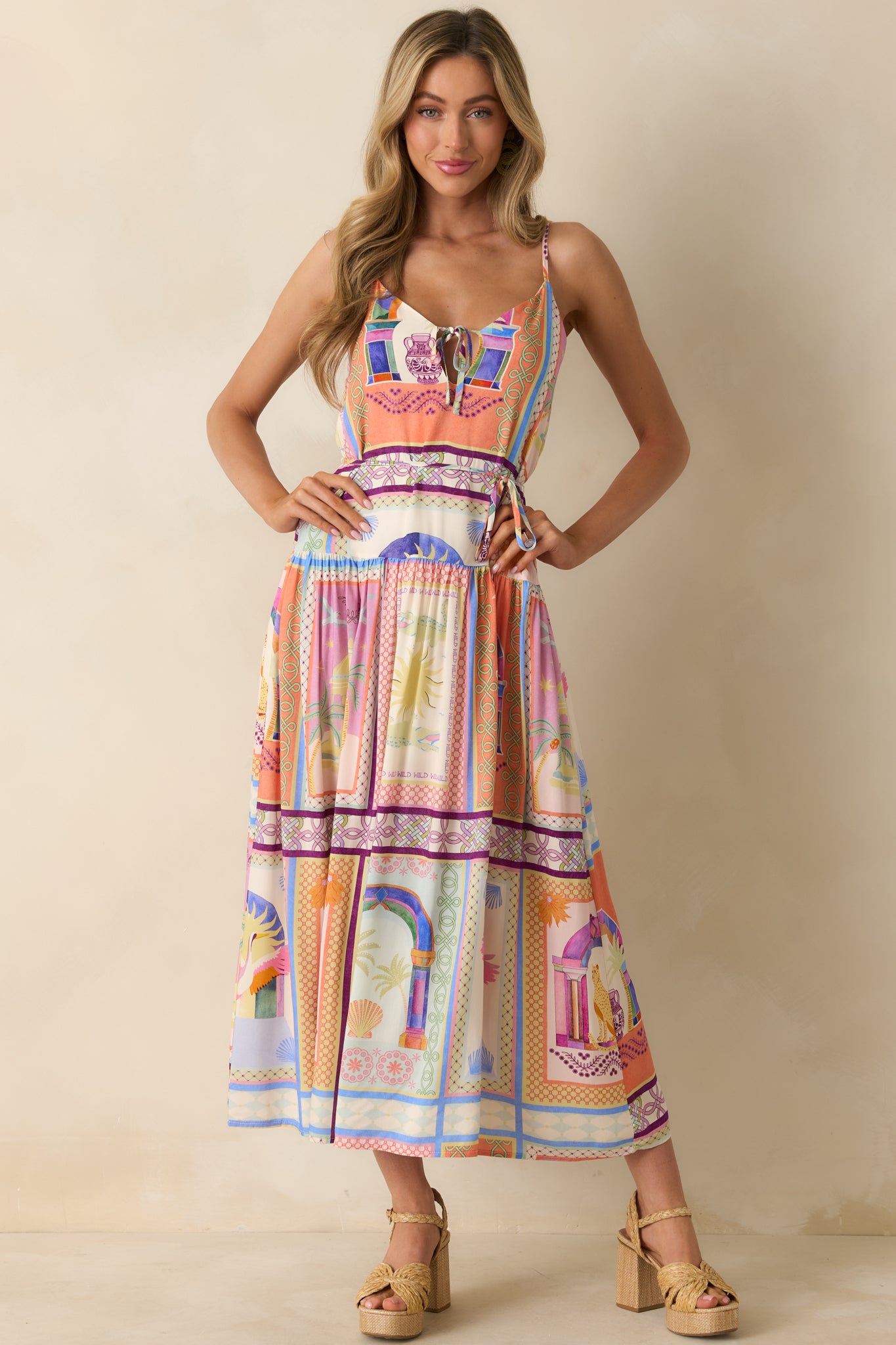 Vibrant tropical print dress displaying the tiered silhouette and lightweight woven feel.