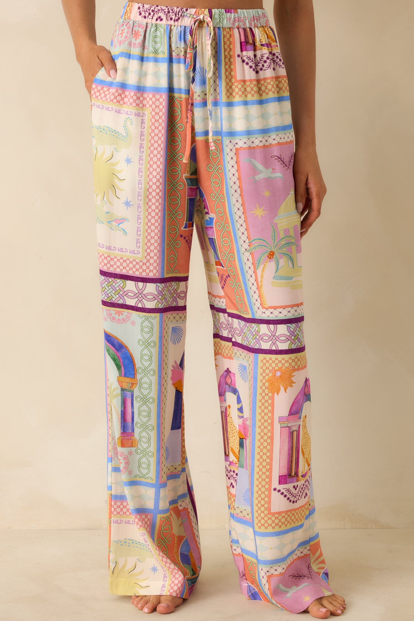 Close-up of the tropical tile print revealing the smooth woven texture and lively multicolor design.