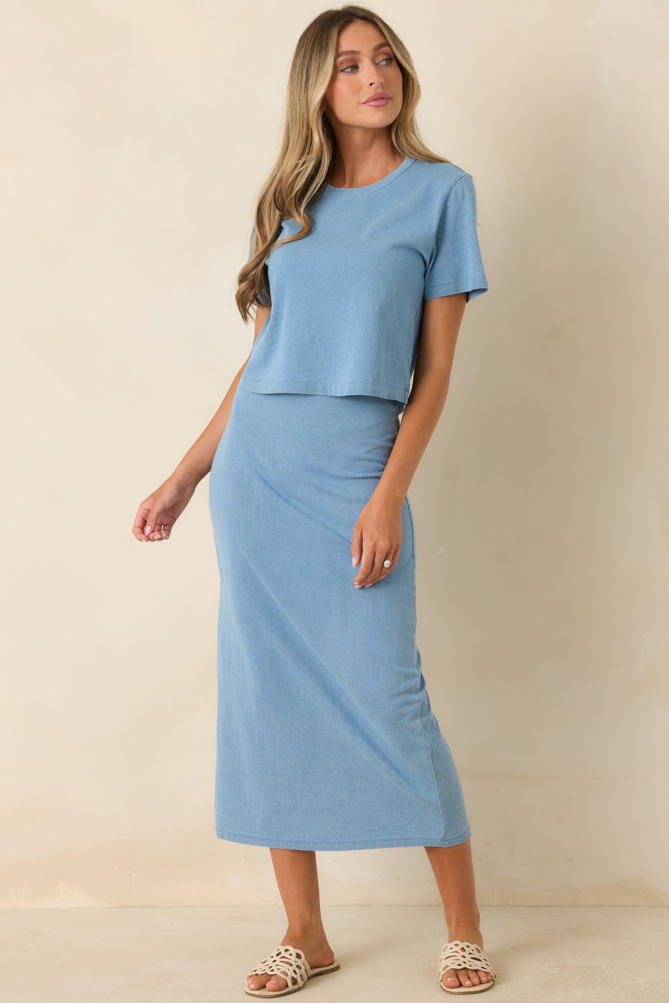 Versatile knit midi skirt designed with a flattering hip fit and denim-inspired finish.
