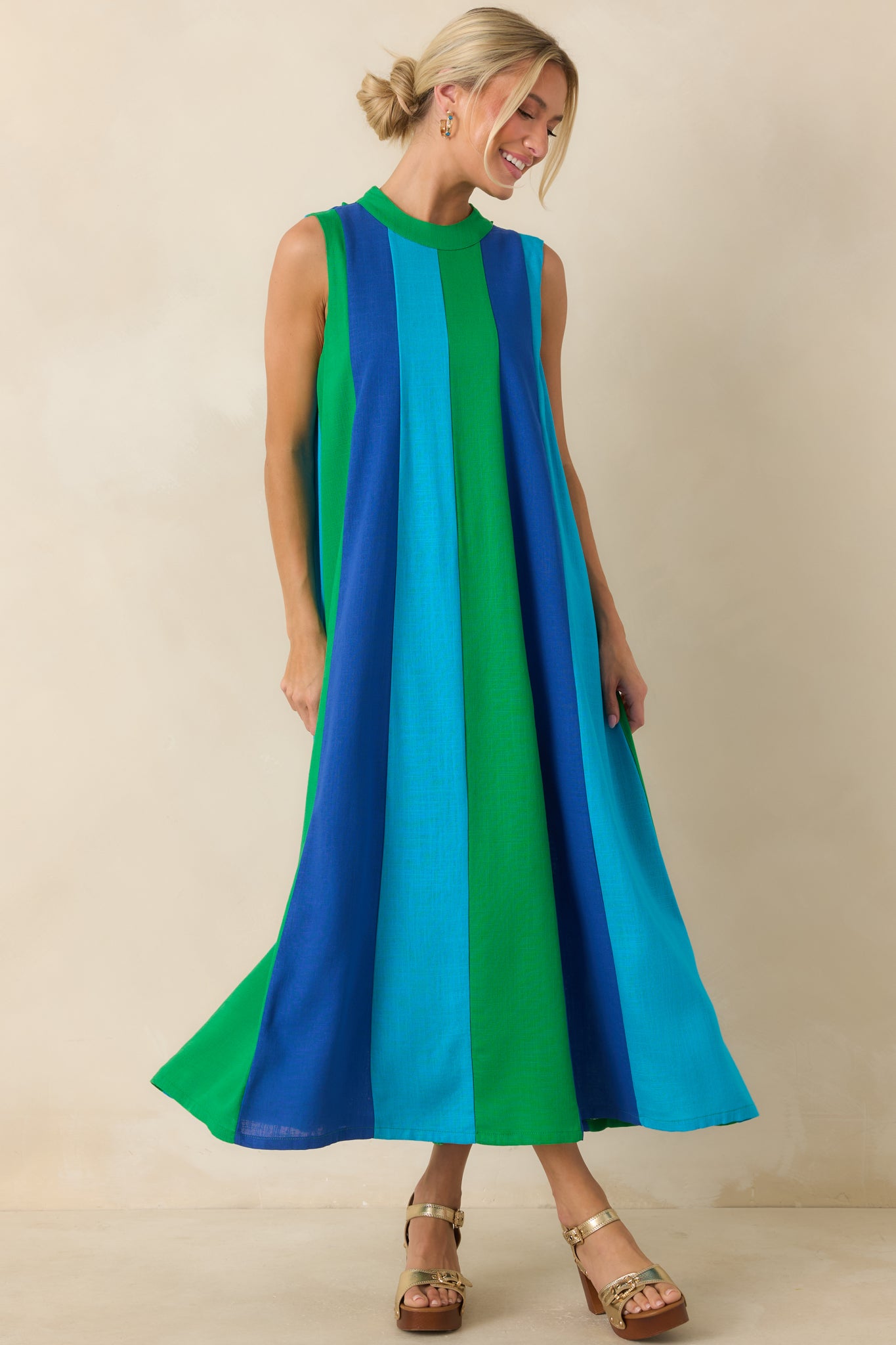 Vibrant midi dress showcasing elongated vertical colorblocking and a relaxed, breezy fit.