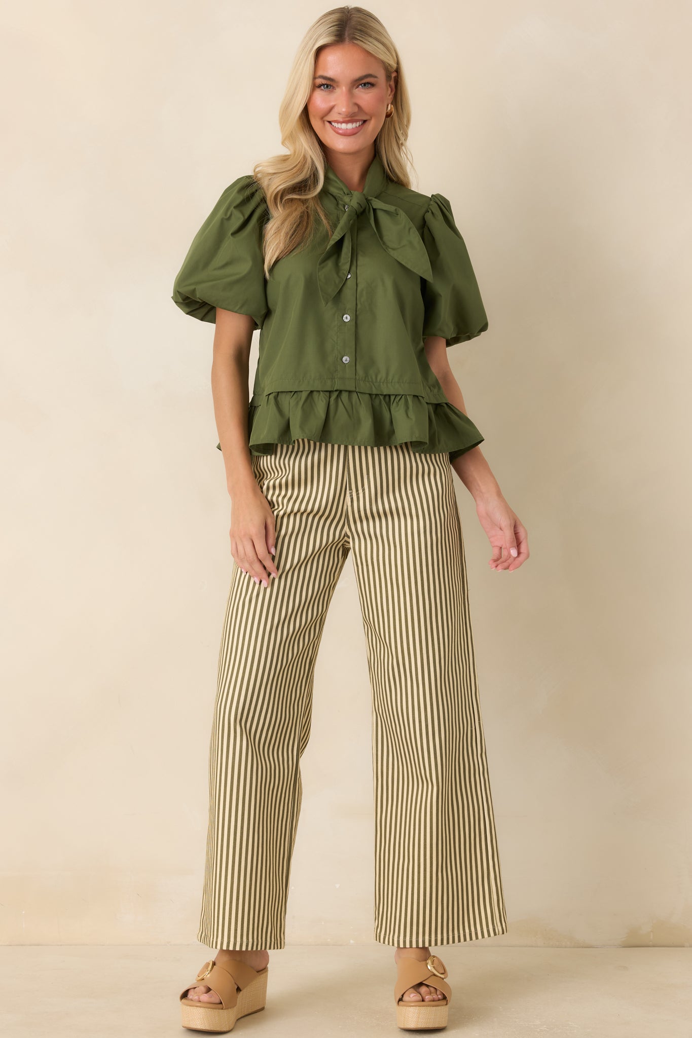 Vertical stripe pants designed with a comfortable relaxed fit, practical pockets, and a versatile everyday silhouette.