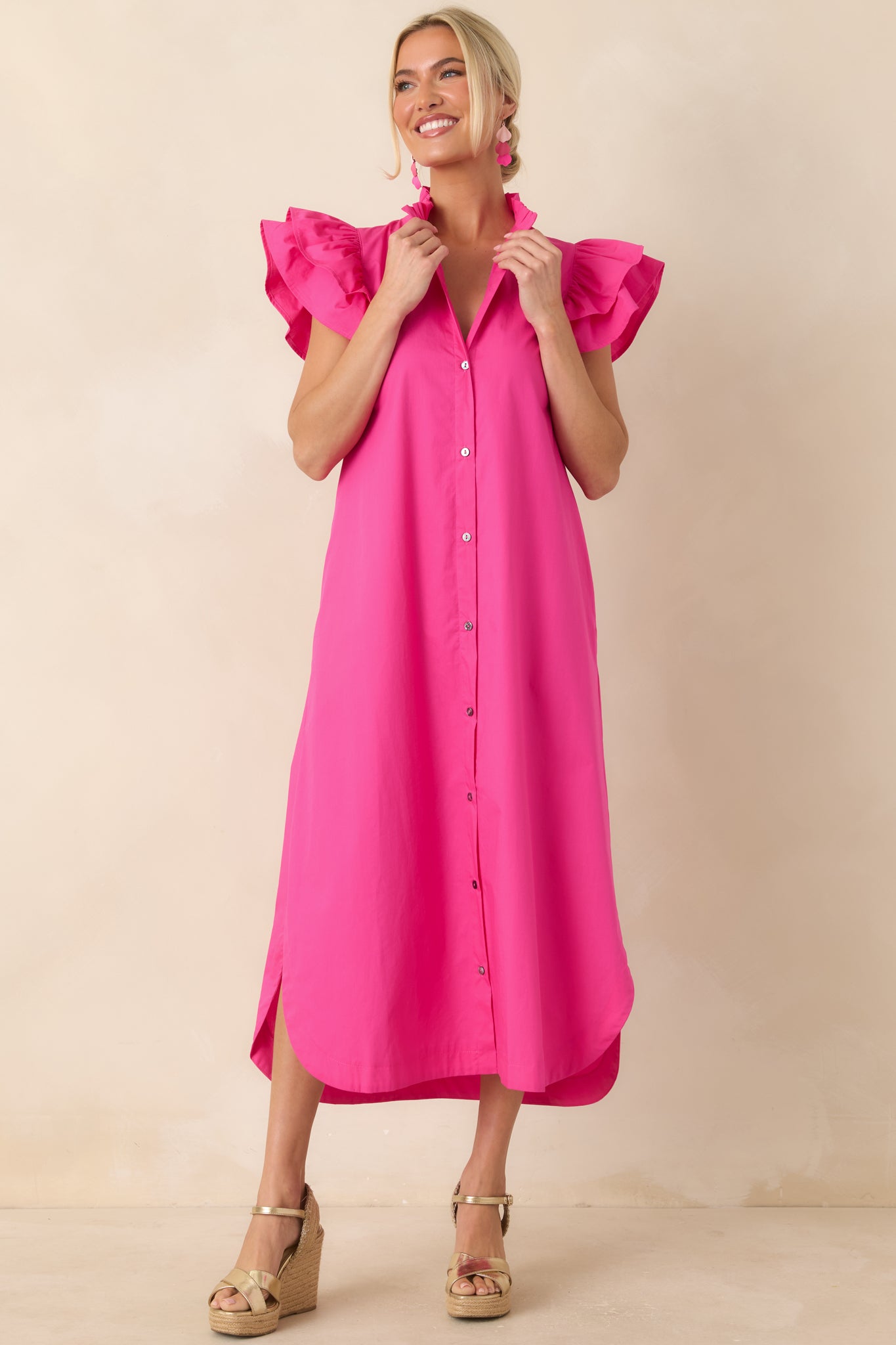 Vibrant cotton midi dress featuring a button-front design, ruffle-trimmed collar, flutter sleeves, and a relaxed tailored silhouette.