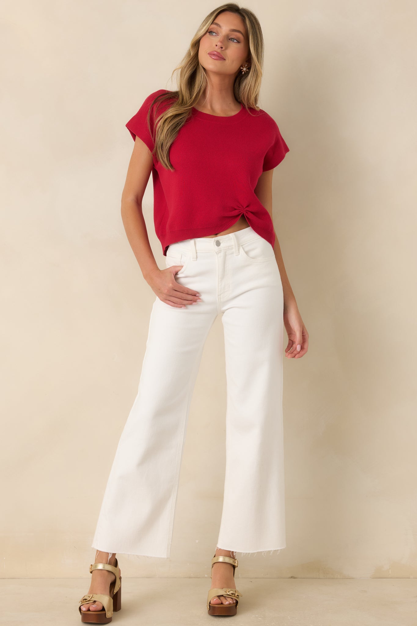 Vibrant red sweater with a relaxed silhouette and subtle cinched detailing that pairs effortlessly with everyday staples.