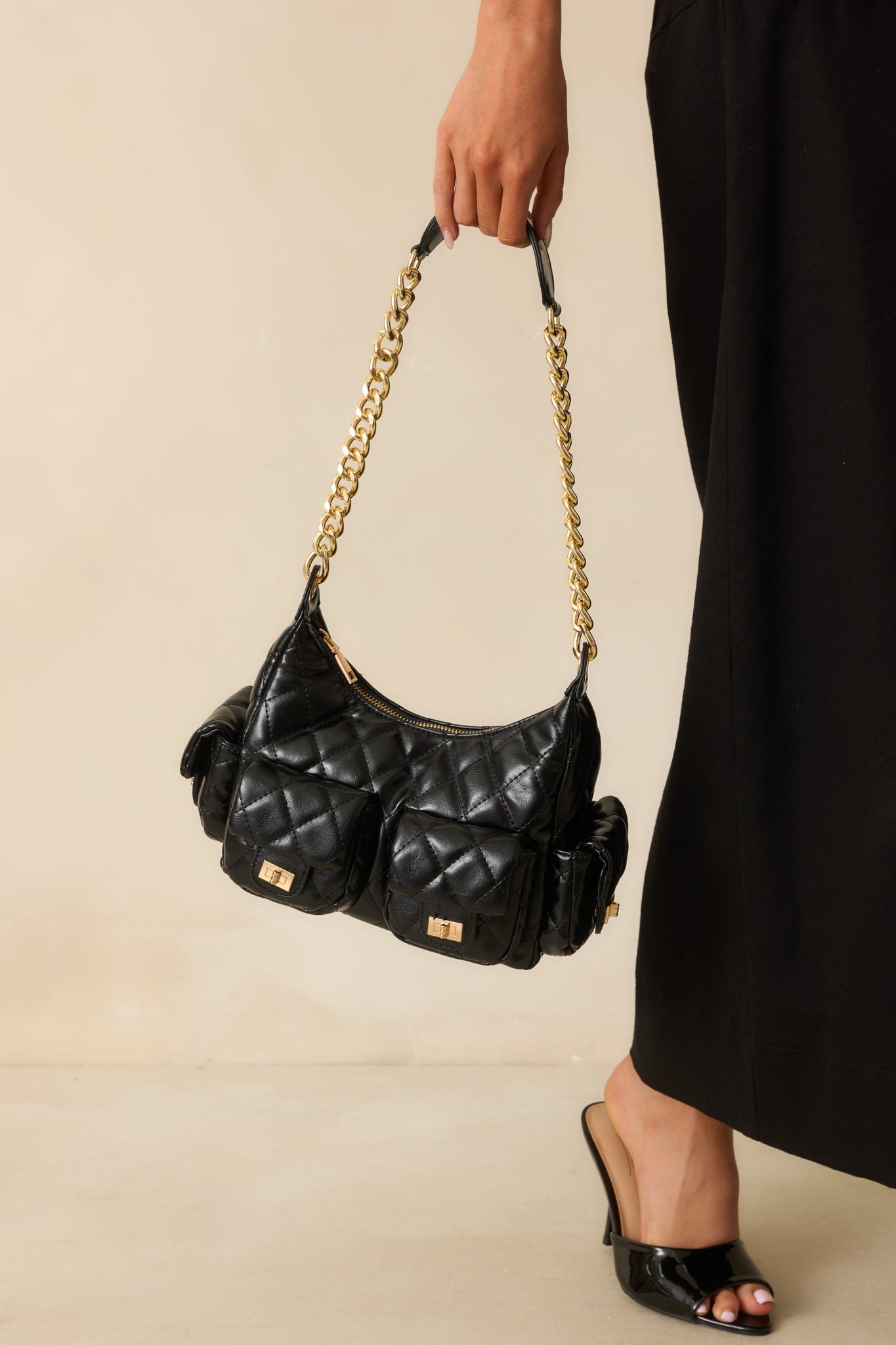 Front view highlighting the multiple exterior flap pockets with turn-lock closures.