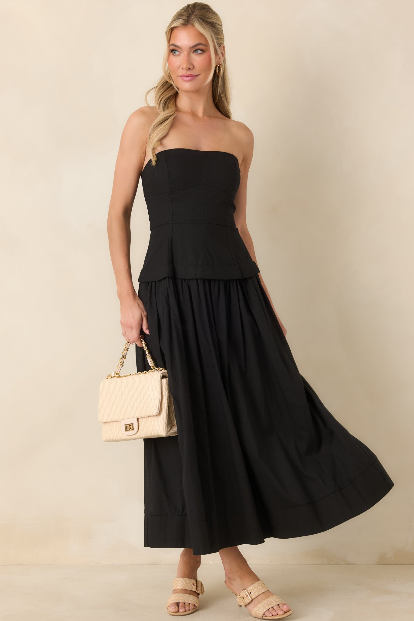 Front view highlighting the adjustable spaghetti straps and softly draped midi-length skirt with added movement.